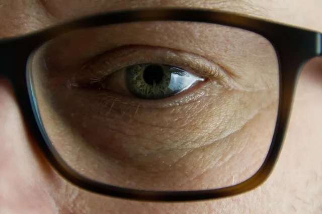 eye, glasses, face, man, close up, person, human, eye, eye, eye, eye, eye, man, person, person. Illinois BIPA compared with Washington My Health My Data for face scans