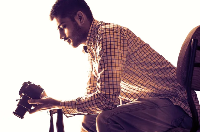 man, camera, photographer, model, male, guy, male model, male photographer, holding a camera. How to run a consent-aware photo shoot in a shared space